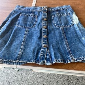BDG Size S-P, 6 button front blue Jean skirt. Length 15 1/2, waist 28” clean